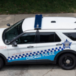 Chicago police officer shot, injured while driving on South Side, suspect in custody